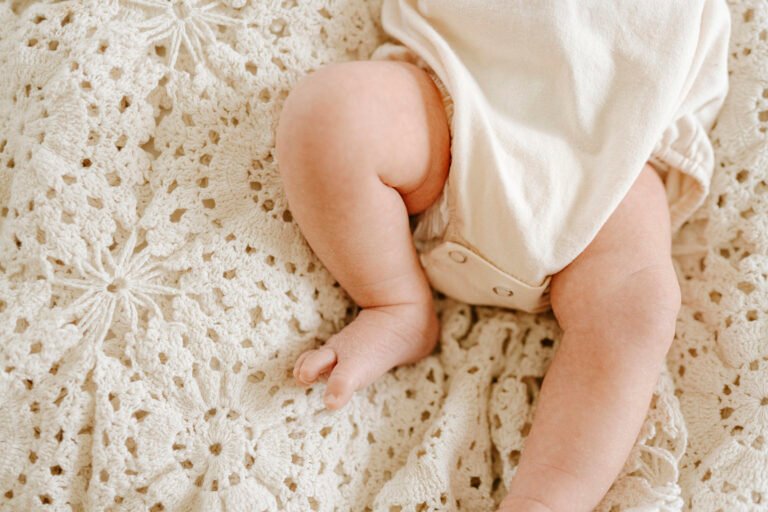 Newborn laying on blanket during newborn session