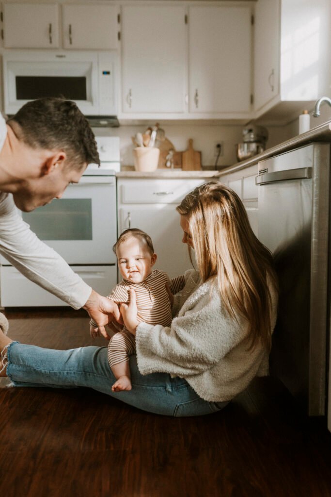 Family sitting in kitchen during family photography session