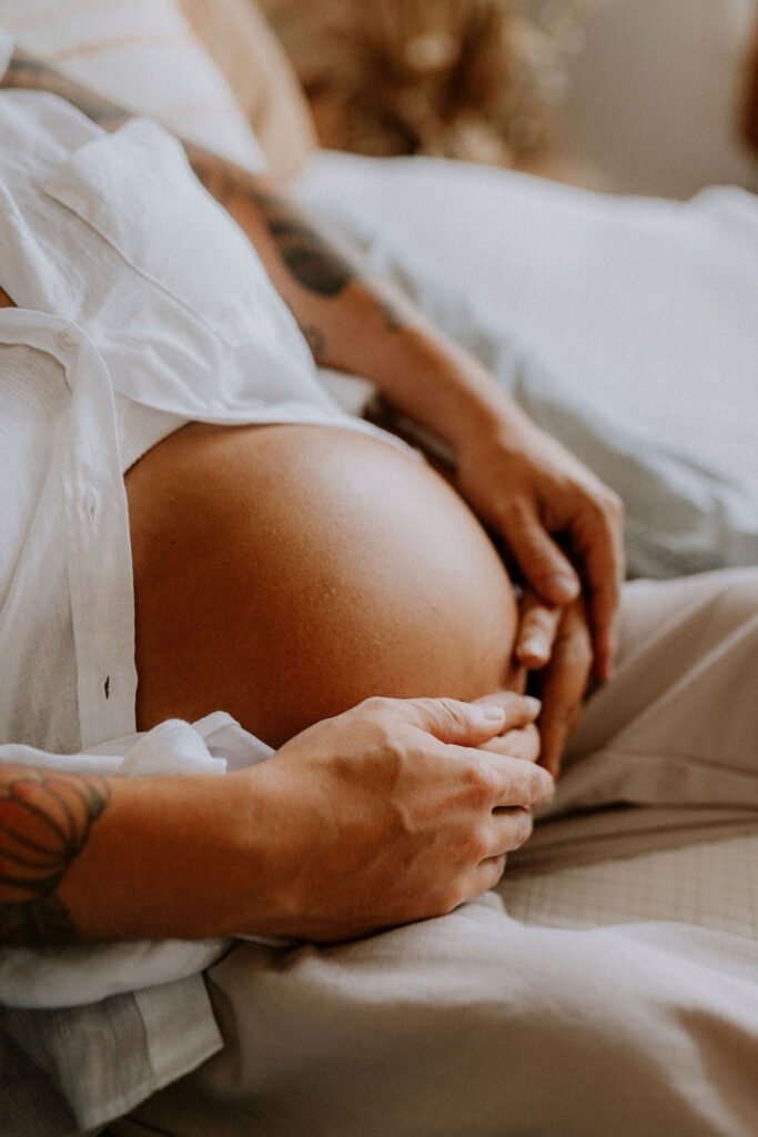 Close-up maternity portrait of woman with SMA showing radiant pregnancy glow