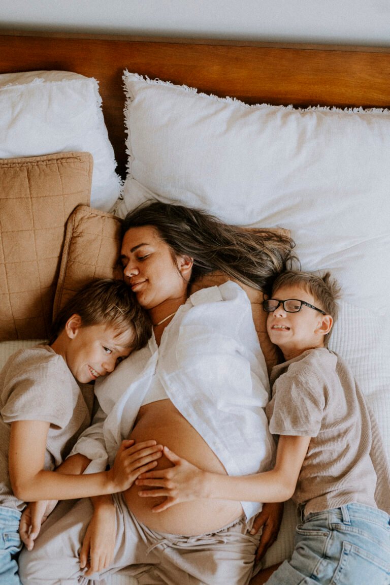 Pregnant woman with disability in comfortable home setting during professional photoshoot